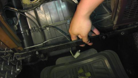 1985 Toyota 4Runner - Working on the air conditioning unit inside a vehicle.
