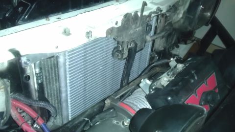 1985 Toyota 4Runner - Aftermarket oil cooler and winch installed in the engine bay.