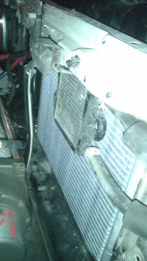 1985 Toyota 4Runner - Close-up of the radiator and AC condenser assembly, showing the fins and mounting brackets.