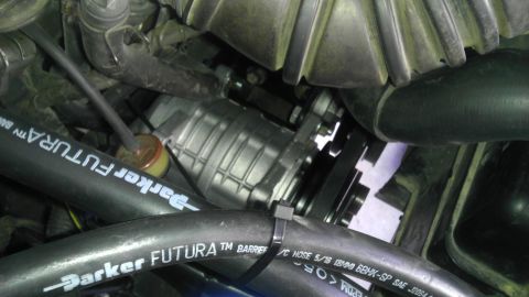 1985 Toyota 4Runner - Engine bay view showing an AC compressor and associated hoses.
