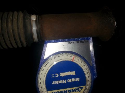 1996 Ford Bronco - A driveshaft angle is being measured with an angle finder tool.