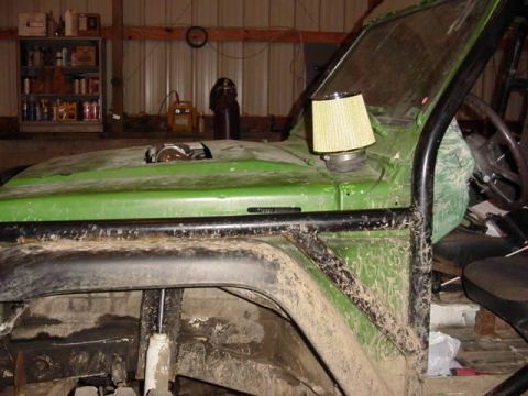 1992 Ford Bronco - Off-road vehicle in a workshop, showing interior, roll cage, and engine bay details.