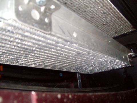 2004 Ford Crown Victoria - The radiator of a 2004 Ford Crown Victoria is visible from a low angle, showing modifications.