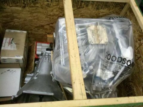 1982 Ford Bronco - Parts are packed in a wooden crate, ready for shipping or storage.