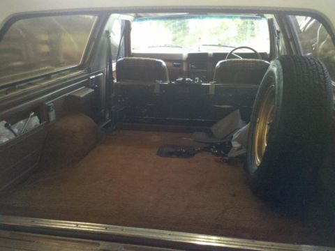 1982 Ford Bronco - The interior of this 1982 Ford Bronco shows the cargo space and the front seating area.