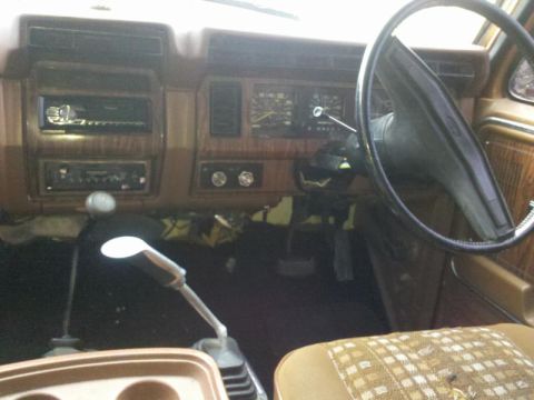 1982 Ford Bronco - Interior view of a truck's dashboard, showing gauges, radio, and shifter setup.