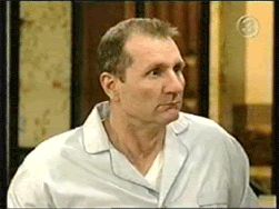 2000 Mercury Grand Marquis - A man in pajamas is seen looking off to the side in this scene.
