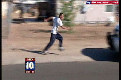 2000 Mercury Grand Marquis - A person is captured mid-stride while running outdoors on a bright, sunny day.
