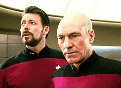 2000 Mercury Grand Marquis - Two Starfleet officers, one with a beard, appear to be reacting to something off-camera.