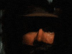 2000 Mercury Grand Marquis - A dimly lit interior shot reveals glowing orange elements, suggesting a vehicle's dashboard or console area.