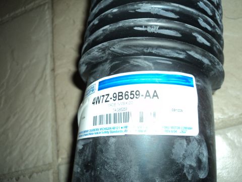 2004 Mercury Grand Marquis - Close-up of a Ford air intake hose, part number 4W7Z-9B659-AA, made in Mexico.