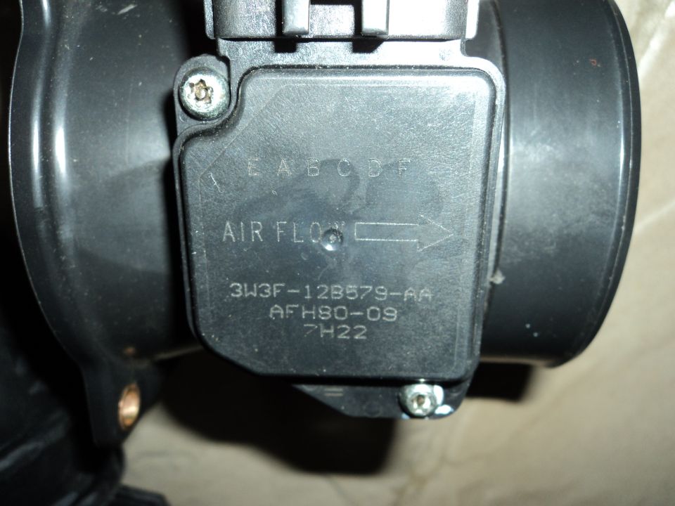 Black mass air flow sensor with "AIR FLOW" and part number "3W3F-12B579-AA" visible