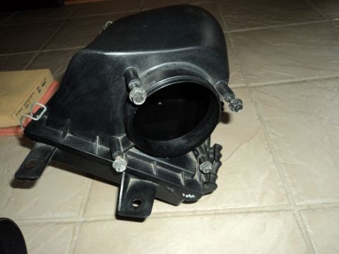 2004 Mercury Grand Marquis - A black plastic air intake box is shown, possibly for a vehicle, with an air filter nearby.