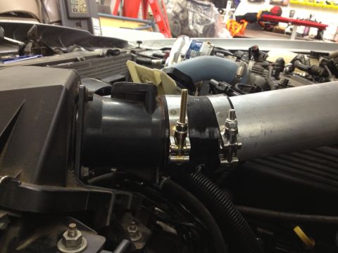 1998 Ford Crown Victoria - The photo shows engine intake pipes and associated hardware, not a complete vehicle.