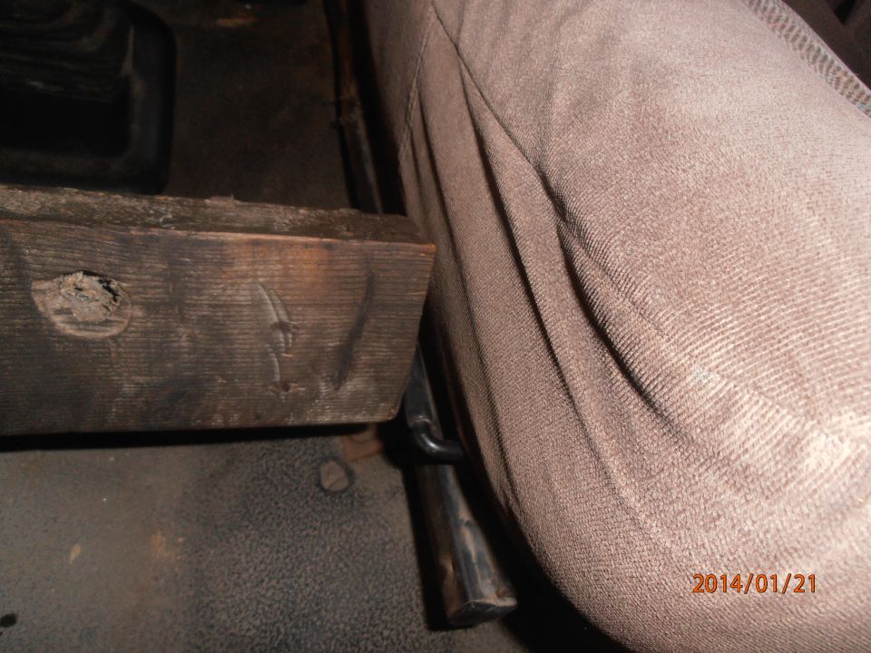 Interior view showing a wooden block and seat fabric