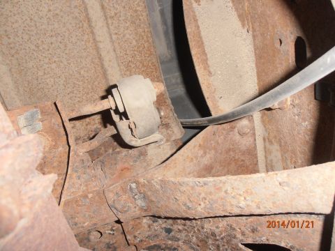 1996 Ford Bronco - Close-up of rusted vehicle frame with suspension component. Date stamp reads 2014/01/21.