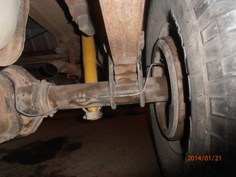 1996 Ford Bronco - Close-up view of the rear axle and suspension system of a vehicle.