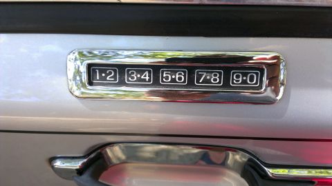 1996 Lincoln Town Car - Close-up of a car's door keypad lock.