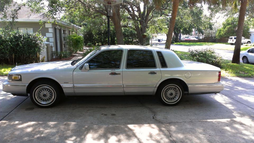 Silver 1990 Lincoln Town Car parked on a driveway