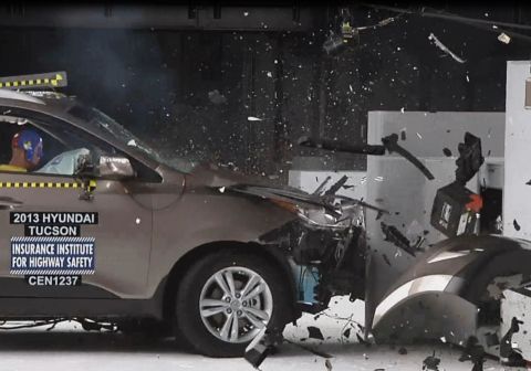 1971 Ford Ranchero - A 2013 Hyundai Tucson is shown after a crash test, with significant front-end damage and debris scattered.