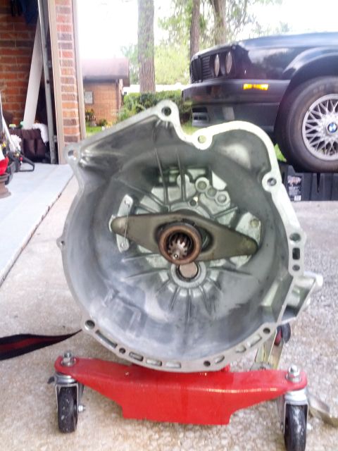 1989 BMW 3 Series - Transmission bell housing is the main subject, with a 1989 BMW 3 Series visible in the background.