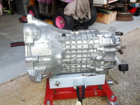 1989 BMW 3 Series - A GETRAG 260 transmission is shown mounted on a red stand.