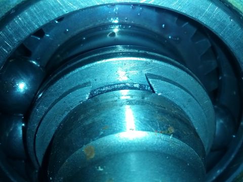 1989 BMW 3 Series - This image shows a close-up view of a mechanical part, likely a bearing and gear assembly, with signs of wear and tear.