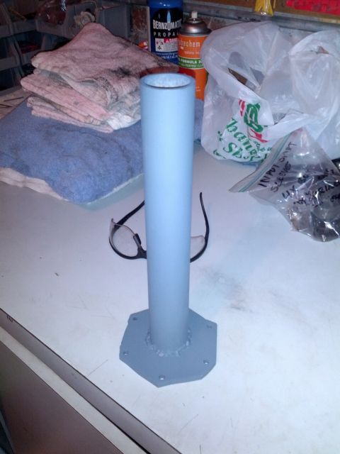 1989 BMW 3 Series - A painted metal pipe with a hexagonal flange is shown on a workbench.