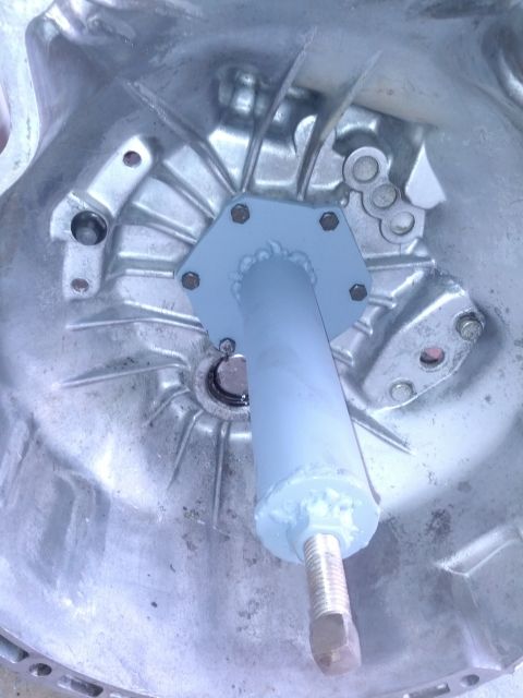 1989 BMW 3 Series - Close-up view of a GETRAG 260 transmission component, a hexagonal mounting plate and a threaded rod.