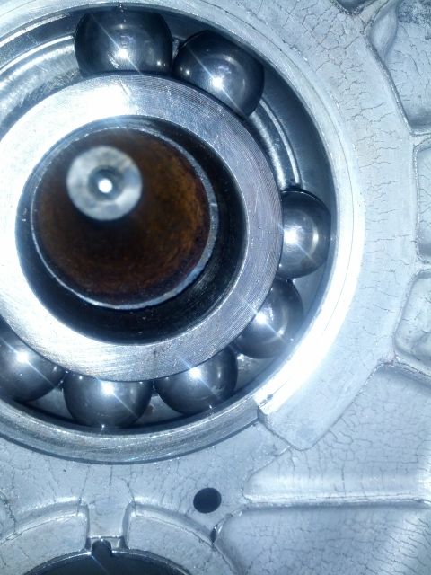 1989 BMW 3 Series - A ball bearing assembly is shown within a metallic casing, with visible wear on the housing.