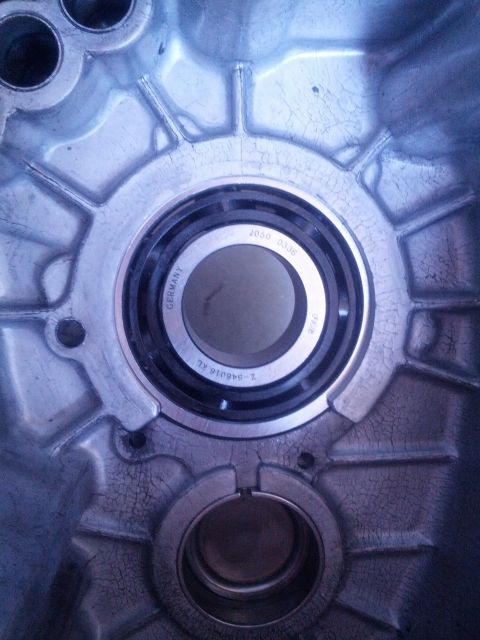 1989 BMW 3 Series - Transmission housing interior with a bearing, part number 2-046016-AL visible.