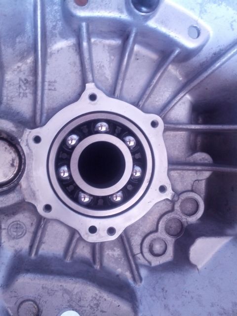 1989 BMW 3 Series - This image shows a close-up view of a bearing assembly within a metal casing, likely part of a vehicle's transmission system.
