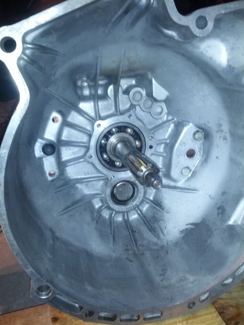 1989 BMW 3 Series - Close-up view of a transmission bell housing, revealing the input shaft and bearing assembly.