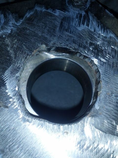 1989 BMW 3 Series - This is a close-up view of a metal part with a hole, showing tool marks and wear.