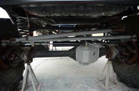 1979 Ford Bronco - Close-up view of the undercarriage, focusing on the differential and suspension system.