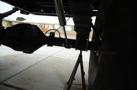 1979 Ford Bronco - Underside view of a vehicle's rear axle and suspension components, including a shock absorber.