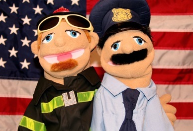 1990 Ford Bronco - Puppets dressed as first responders stand before the American flag.