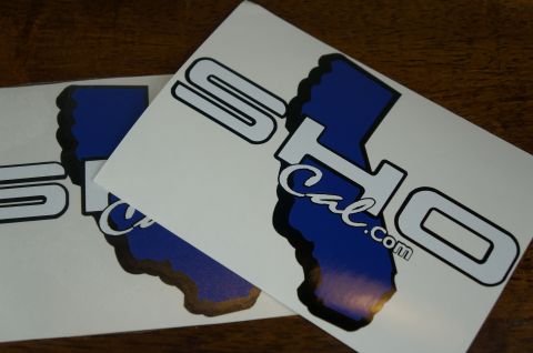 1993 Ford Taurus - Decals with 'SO Cal.com' text and California map outlines are shown on a wooden surface.