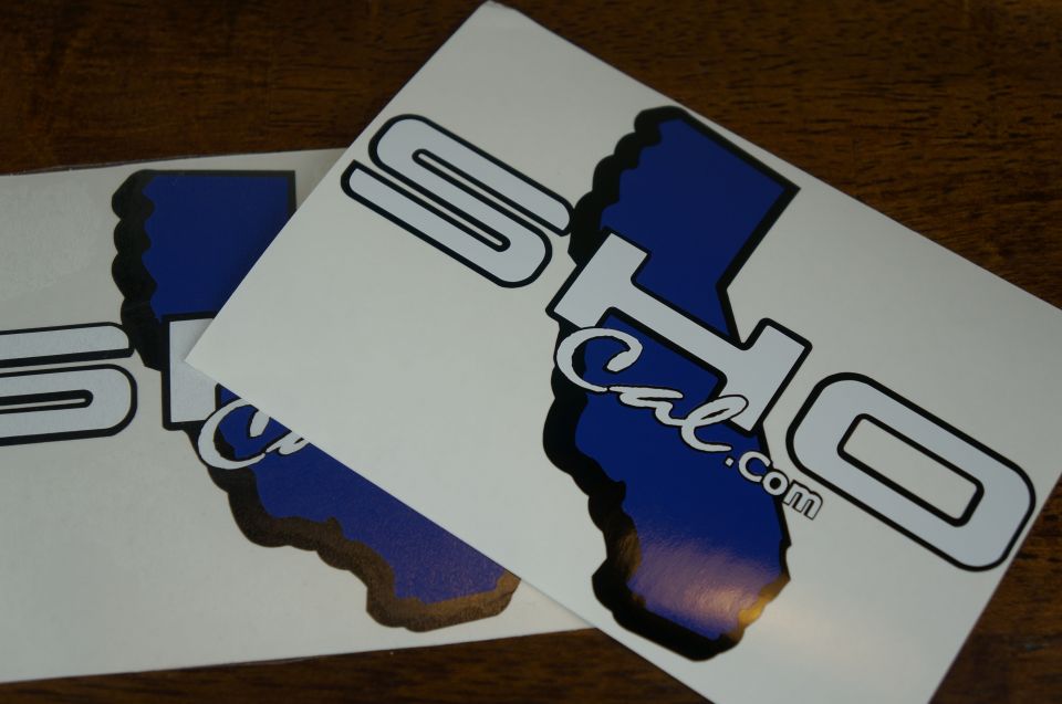 Two white decals with blue California map outlines and black borders. Text reads 'SO Cal.com'