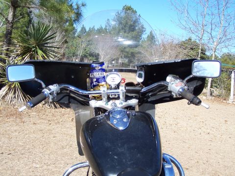 1998 Honda Shadow VT750C - View from the rider's perspective showing the handlebars, instrument cluster, and fuel tank of a motorcycle.