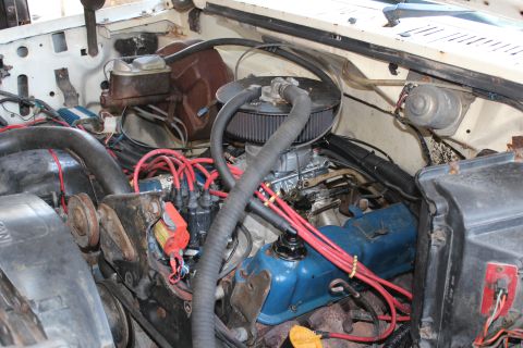 1982 Ford Bronco - Close-up view of the engine compartment, showing various mechanical components and wiring.