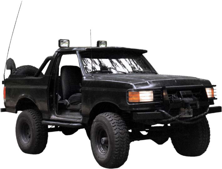 1990 Ford Bronco, black, with aftermarket winch, off-road lights, and spare tire mounted on rear