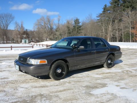 2001 Ford Crown Victoria - This 2001 Ford Crown Victoria sedan is parked in a snowy lot under a clear blue sky.