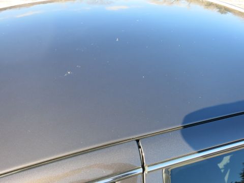 2001 Ford Crown Victoria - Close-up of the roof and chrome trim on a 2001 Ford Crown Victoria.