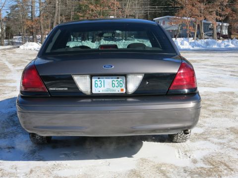 2001 Ford Crown Victoria - Rear view of a 2001 Ford Crown Victoria Police Interceptor parked in a snowy area.