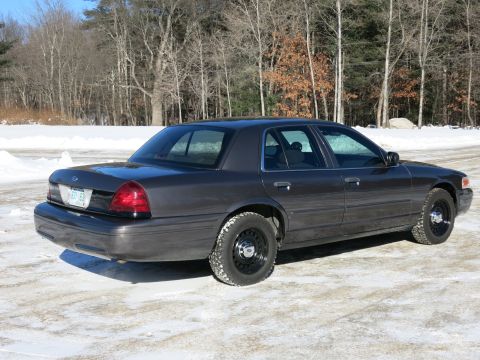 2001 Ford Crown Victoria - This 2001 Ford Crown Victoria is seen from a rear three-quarter angle on a winter day.