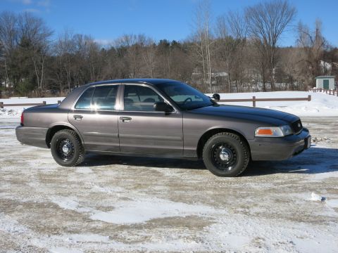 2001 Ford Crown Victoria - Side view of a 2001 Ford Crown Victoria in a winter setting.