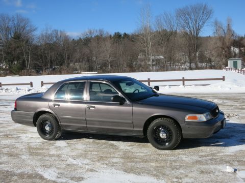 2001 Ford Crown Victoria - A 2001 Ford Crown Victoria is shown in a three-quarter front view on a winter day.