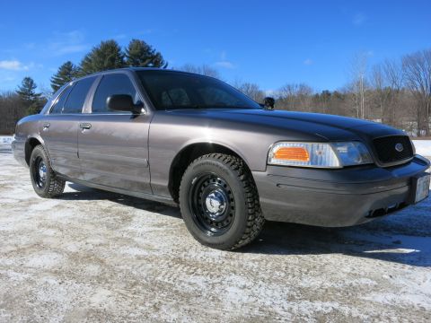2001 Ford Crown Victoria - This Ford Crown Victoria is shown from the front three-quarter view on a clear day.
