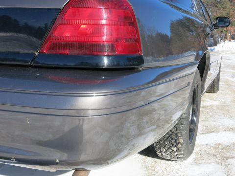 2001 Ford Crown Victoria - Rear view of a 2001 Ford Crown Victoria, showing its distinctive taillight and bumper design.